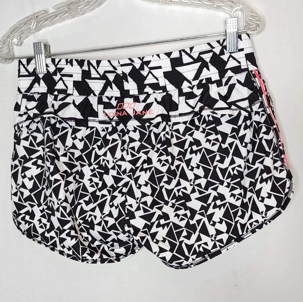 Lorna Jane running shorts. Pink side zippers. Built in shorts. Size XS. - Picture 3 of 11